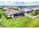 Aerial view of a spacious backyard with a screened lanai and well-maintained landscaping at 16943 Rosedown Gln, Parrish, FL 34219
