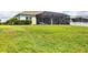 Expansive backyard featuring a screened lanai, perfect for outdoor relaxation and entertaining at 16943 Rosedown Gln, Parrish, FL 34219