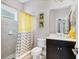 Modern bathroom with yellow accents, tiled shower, and sleek vanity at 16943 Rosedown Gln, Parrish, FL 34219