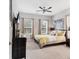 Bright bedroom with two windows, yellow accents, and modern decor at 16943 Rosedown Gln, Parrish, FL 34219
