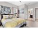 Bedroom with ensuite bathroom, bright windows and urban decor at 16943 Rosedown Gln, Parrish, FL 34219