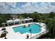 Aerial view of the community pool, spa, cabanas, and lush landscaping at 16943 Rosedown Gln, Parrish, FL 34219