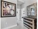 Hallway featuring a dresser, a mirror, and artwork on the wall at 16943 Rosedown Gln, Parrish, FL 34219