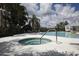 Community hot tub steps away from the main pool area and palm trees at 16943 Rosedown Gln, Parrish, FL 34219