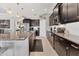 Well-equipped kitchen featuring stainless steel appliances, a kitchen island, and granite countertops at 16943 Rosedown Gln, Parrish, FL 34219