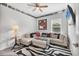 Comfortable living room with sectional sofa, zebra rug, and ceiling fan at 16943 Rosedown Gln, Parrish, FL 34219
