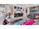 Stylish living room featuring modern decor, a colorful rug, and comfortable seating for a relaxing ambiance at 16943 Rosedown Gln, Parrish, FL 34219