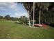 Canoes and kayaks are stored next to a community beach volleyball court at 16943 Rosedown Gln, Parrish, FL 34219