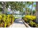 Scenic walking path alongside a tranquil lake at 16943 Rosedown Gln, Parrish, FL 34219
