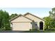 Charming single-story home with a manicured lawn and a neutral color scheme at 17365 Whiskey Creek Trl, Parrish, FL 34219