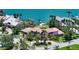 Waterfront house with a backyard leading to a private dock and complemented by lush trees at 203 Robin Dr, Sarasota, FL 34236