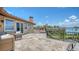 Expansive outdoor balcony boasts picturesque water views and plenty of room for outdoor seating and entertaining at 203 Robin Dr, Sarasota, FL 34236