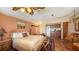 Stylish bedroom boasts tile floors, a kitchenette, and a comfortable bed creating an inviting and functional space at 203 Robin Dr, Sarasota, FL 34236