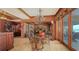 Refined dining space with water view, a decorative chandelier, and stylish seating, ideal for creating memorable dining experiences at 203 Robin Dr, Sarasota, FL 34236