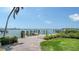 Private dock and walkway offering direct water access with manicured landscaping at 203 Robin Dr, Sarasota, FL 34236