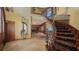 Impressive foyer featuring a curved staircase, beautiful flooring, and elegant finishes, setting the tone for a sophisticated home at 203 Robin Dr, Sarasota, FL 34236