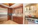 Gourmet kitchen features stainless steel appliances, custom cabinetry, and granite countertops at 203 Robin Dr, Sarasota, FL 34236