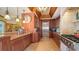 Gourmet kitchen features stainless steel appliances, custom cabinetry, and granite countertops at 203 Robin Dr, Sarasota, FL 34236