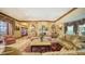 Sophisticated living room with plush seating, fireplace, and decorative accents, perfect for relaxation and entertaining guests at 203 Robin Dr, Sarasota, FL 34236
