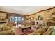 Well-appointed living room with water view, comfortable seating, and fireplace, creating a cozy and refined atmosphere at 203 Robin Dr, Sarasota, FL 34236