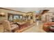 Gracious living room featuring classic furnishings, decorative accents, and abundant natural light, ideal for comfortable living at 203 Robin Dr, Sarasota, FL 34236