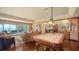 Large entertainment space with billiards table, water views, and seating area for relaxing and entertaining at 203 Robin Dr, Sarasota, FL 34236