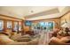 Relaxing living room featuring sliding doors that lead to the backyard overlooking the river at 203 Robin Dr, Sarasota, FL 34236