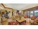 Inviting living room with elegant furnishings, decorative rug, and large windows, offering a comfortable and stylish living space at 203 Robin Dr, Sarasota, FL 34236