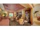 Cozy living room with a fireplace, comfortable seating, and natural lighting near stairs at 203 Robin Dr, Sarasota, FL 34236