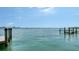 Panoramic waterfront view from a dock, featuring calm water and a distant skyline, ideal for serene coastal living at 203 Robin Dr, Sarasota, FL 34236