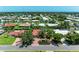 Aerial shot of a charming neighborhood with well-maintained homes and landscaped lawns at 216 Matisse Cir, Nokomis, FL 34275