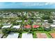 Overhead view of the property within a verdant neighborhood, revealing a screened-in pool area at 216 Matisse Cir, Nokomis, FL 34275