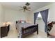 Bedroom featuring a dark wooden desk and a ceiling fan at 216 Matisse Cir, Nokomis, FL 34275