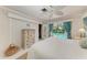 Inviting bedroom with neutral tones, an overhead fan, and a clear view of the backyard pool at 216 Matisse Cir, Nokomis, FL 34275