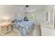 Bedroom with a ceiling fan and windows at 216 Matisse Cir, Nokomis, FL 34275