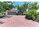 Charming one-story home featuring a spacious driveway and meticulously maintained landscaping at 216 Matisse Cir, Nokomis, FL 34275