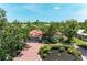 Inviting single-story home with a spacious driveway and lush, manicured greenery at 216 Matisse Cir, Nokomis, FL 34275