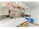 Spacious kitchen featuring a large island, breakfast bar, stainless steel appliances and custom copper hanging pot rack at 216 Matisse Cir, Nokomis, FL 34275