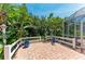 Brick patio with lush landscaping surrounding the fenced-in space at 216 Matisse Cir, Nokomis, FL 34275