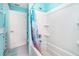 Bathroom featuring tub with colorful shower curtain, tile floors, and white vanity at 217 Mariner Ln, Rotonda West, FL 33947