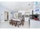 Bright kitchen with stainless steel appliances, granite countertops, and a breakfast bar at 217 Mariner Ln, Rotonda West, FL 33947