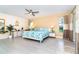 Spacious main bedroom featuring tiled floor, ceiling fan, and serene décor at 217 Mariner Ln, Rotonda West, FL 33947