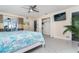 Bright main bedroom featuring tiled floor, ceiling fan, and patio access at 217 Mariner Ln, Rotonda West, FL 33947