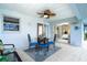 Covered patio with dining set and ceiling fan, great for outdoor dining and relaxation at 217 Mariner Ln, Rotonda West, FL 33947