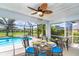 Relaxing screened-in pool area with dining and lounge spaces, ideal for enjoying the Florida sunshine at 217 Mariner Ln, Rotonda West, FL 33947
