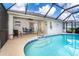 Sparkling pool with patio and outdoor dining space, perfect for entertaining guests at 217 Mariner Ln, Rotonda West, FL 33947