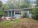 Inviting single-story home featuring muted paint and manicured front yard at 2212 Vinson Ave, Sarasota, FL 34232