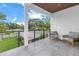 Spacious covered balcony featuring outdoor seating with neighborhood views at 2314 Floyd St, Sarasota, FL 34239