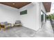 Open-air balcony featuring modern seating and a peaceful view at 2314 Floyd St, Sarasota, FL 34239