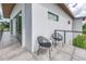 Stylish outdoor balcony with seating, offering scenic views of the surrounding landscape at 2314 Floyd St, Sarasota, FL 34239